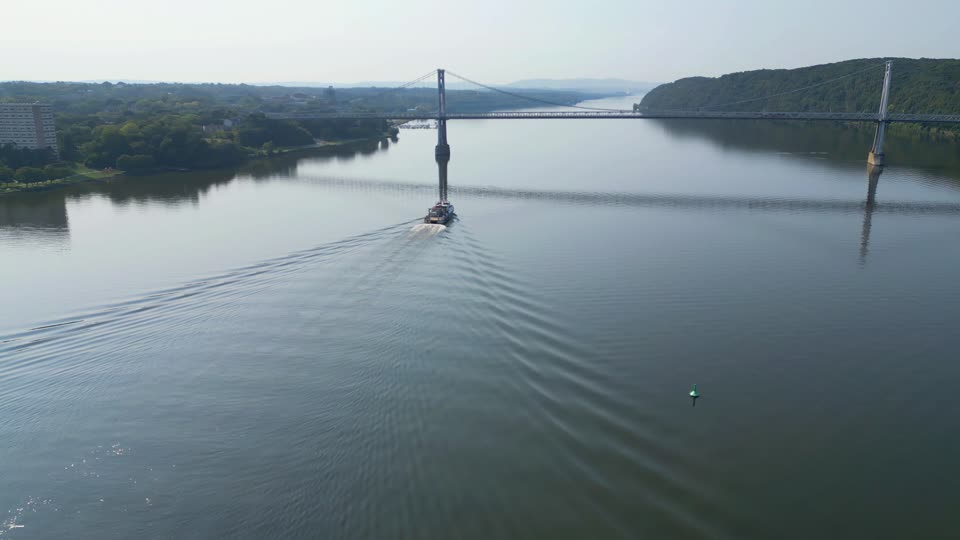 A boat and Poughkeepsie from the river
