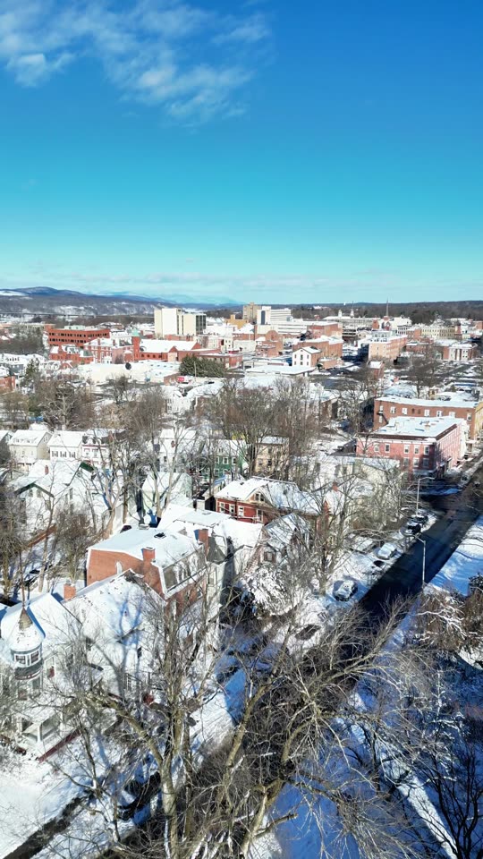 Ascending over downtown Poughkeepsie in winter 2 (vert)