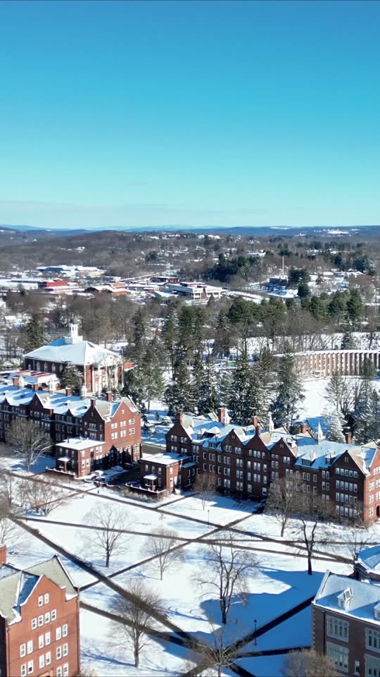 Ascending over the Vassar campus in winter (vert)