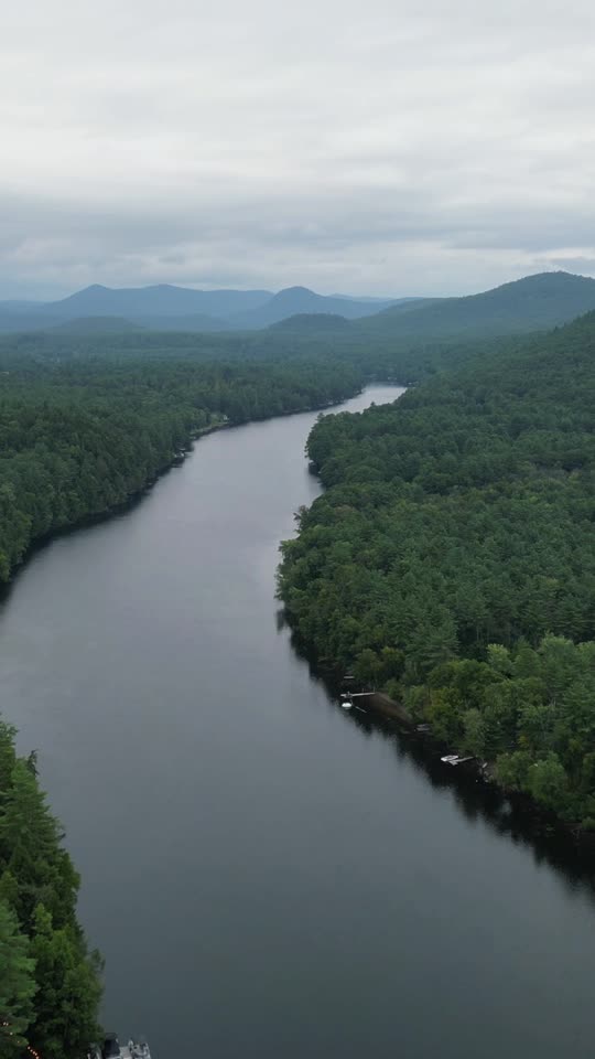 Flying backwards over the upper Hudson looking towards the Adirondacks (vert)