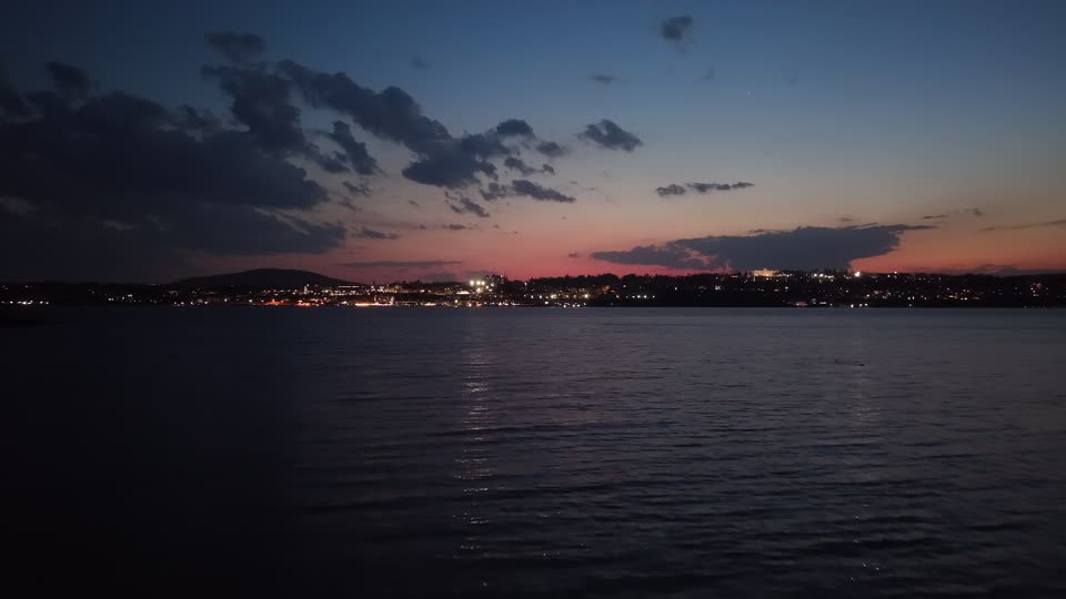 Flying over the river towards Newburgh ta night