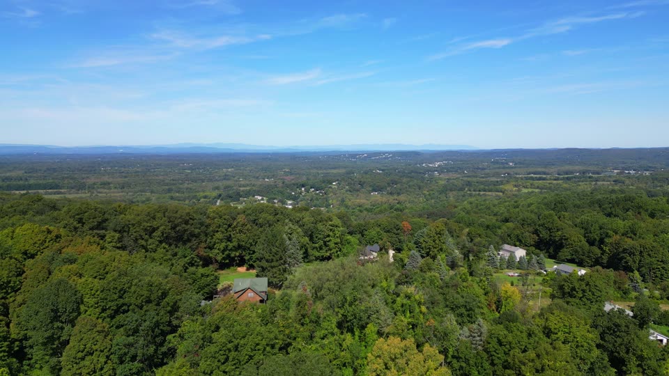 Flying over woods and fields towards the Catskills