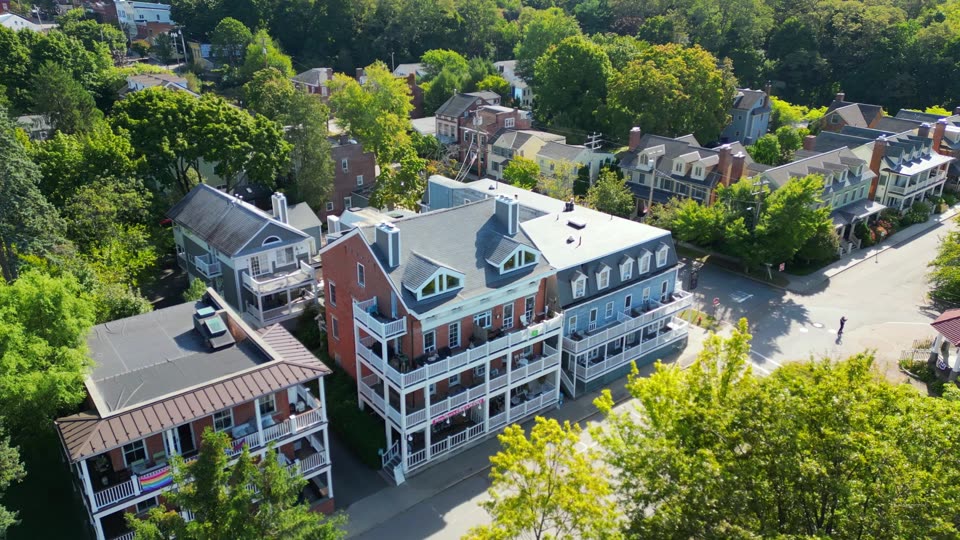 Flying parallel to the Cold Spring waterfront buildings