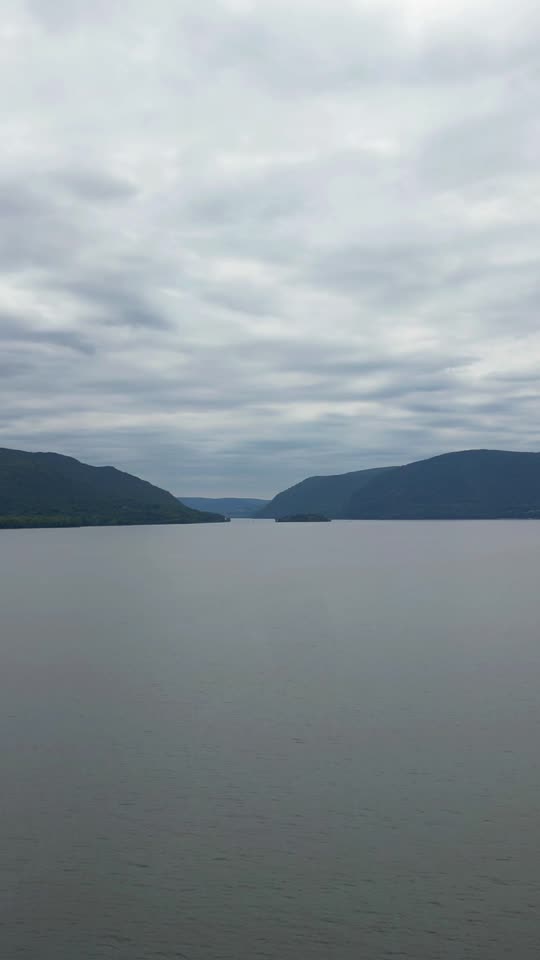 Flying towards Bannermans Castle from the Newburgh waterfront on an overcast day (vert)