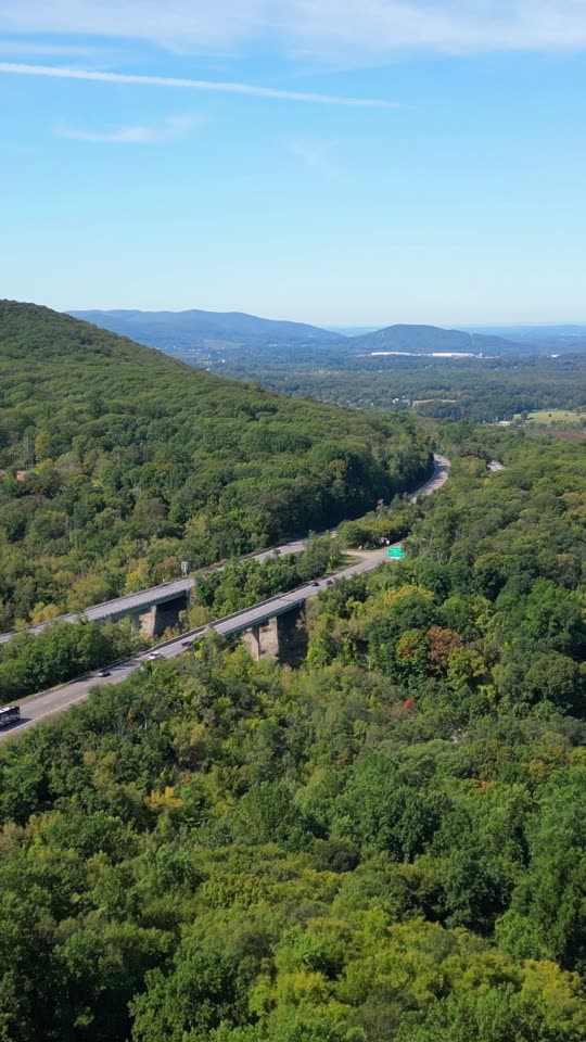 Flying towards two highway bridges (Vert)