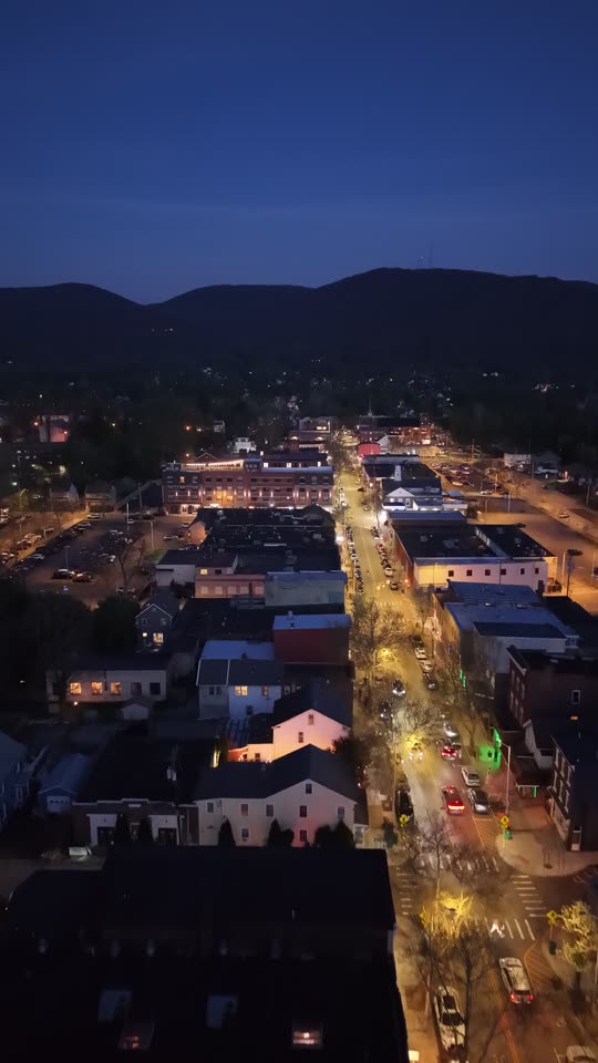 Flying up Main Street Beacon at night