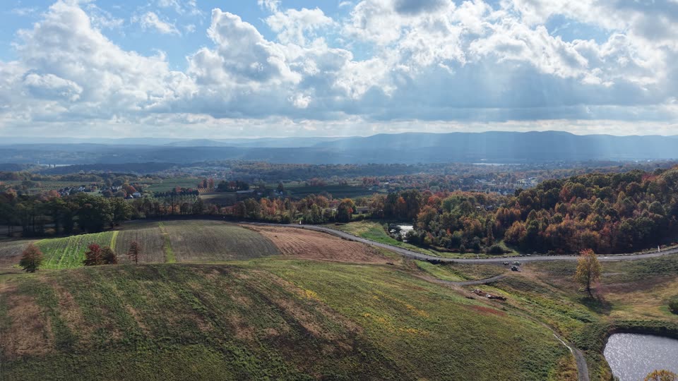 Flying over farmland towards the river