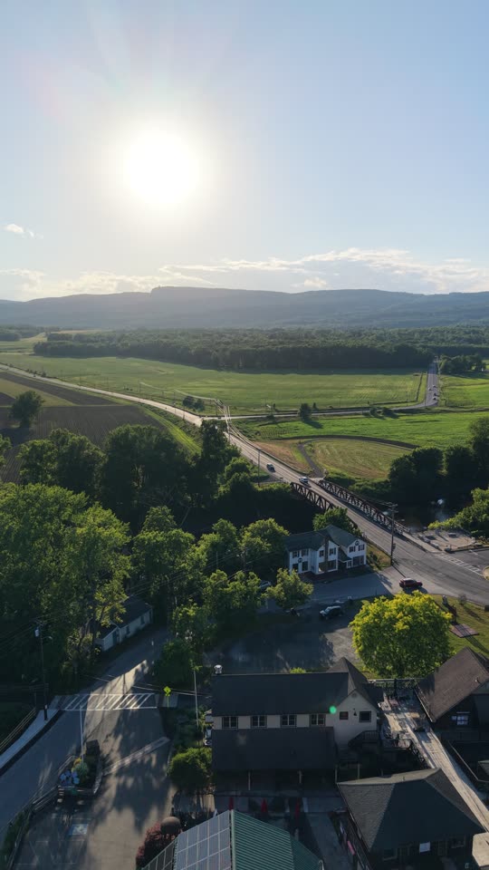 Pull back over Water Street Market looking towards the Shawangunks in New Paltz in evening