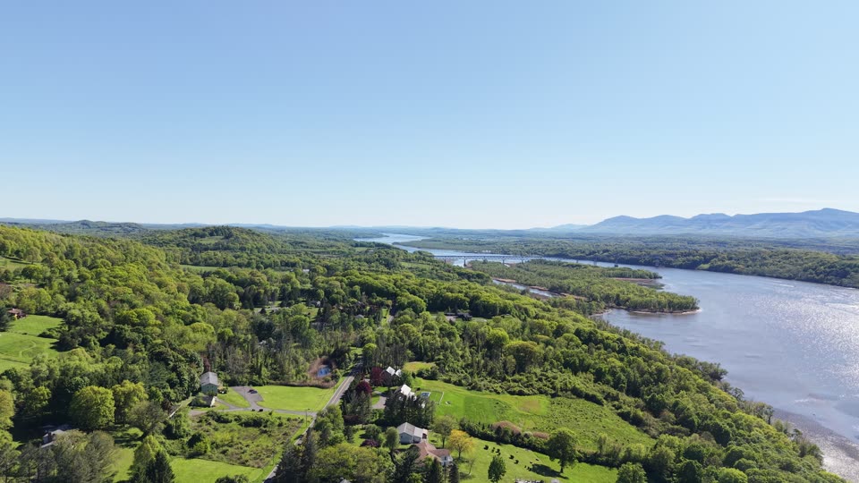 Pulling back from the Rip Van Winkle Bridge and the Catskills near Hudson