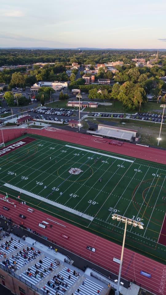 Pulling back over Dietz Stadium looking towards Uptown Kingston evening