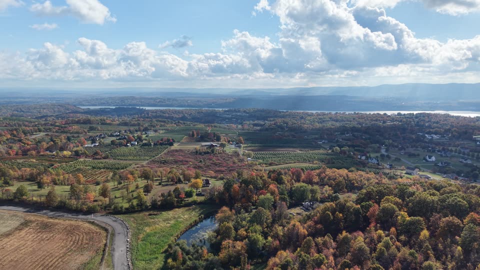 Orbiting over farmland towards the river