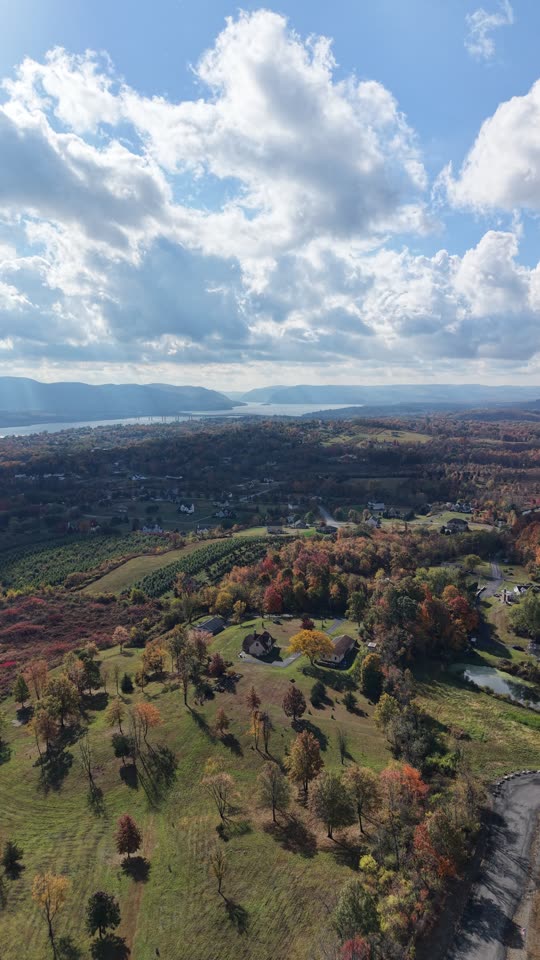 Panning sideways over farmland with the Hudson River in the distance
